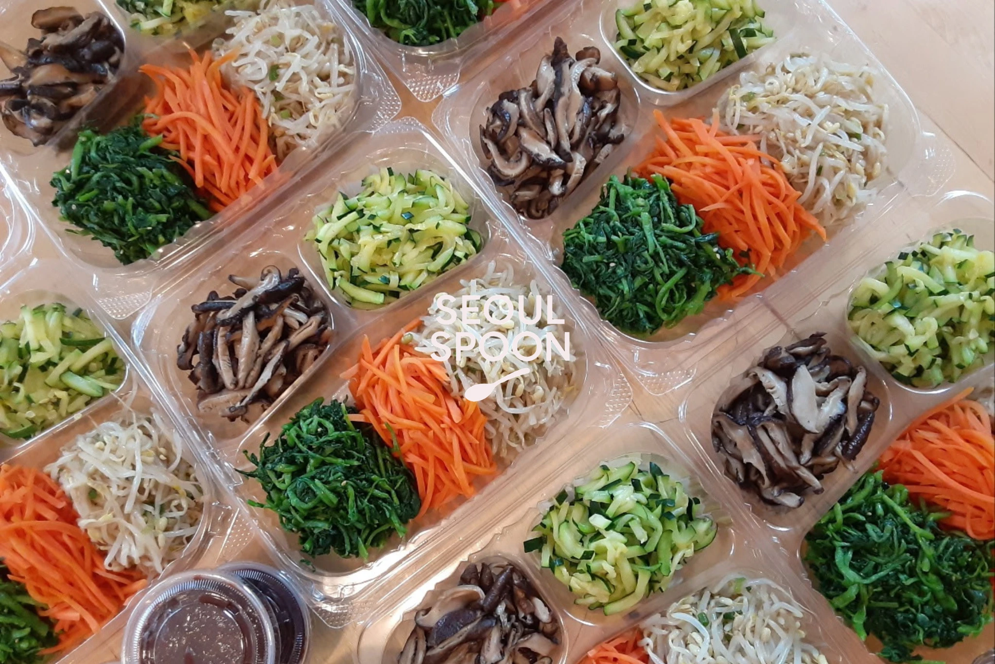 Bibimbap vegetable toppings packed in clear trays